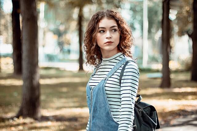 Attractive Hungarian woman taking a walk in the woods. 