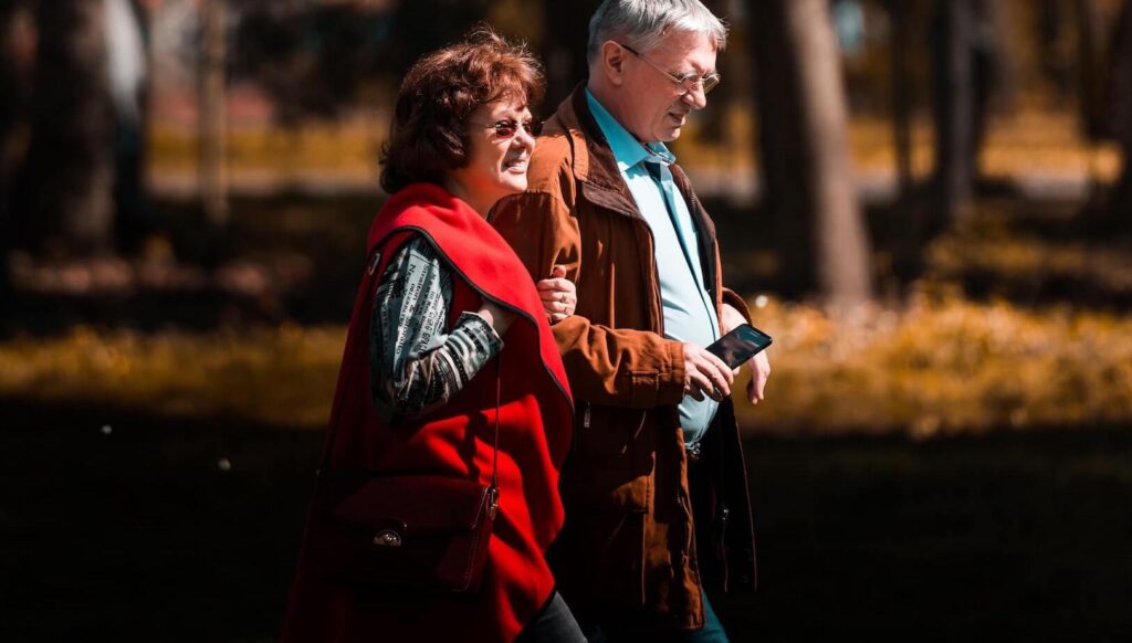 Old couple goes for a walk