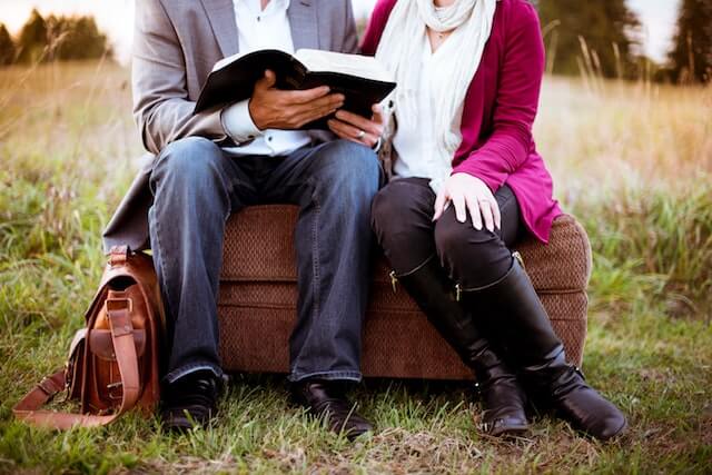 Two god-fearing singles reading the bible together. 