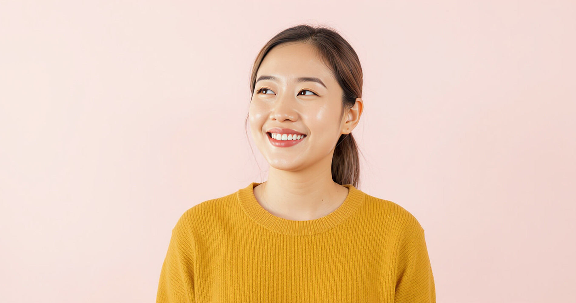 Confident Thai woman smiling in daylight